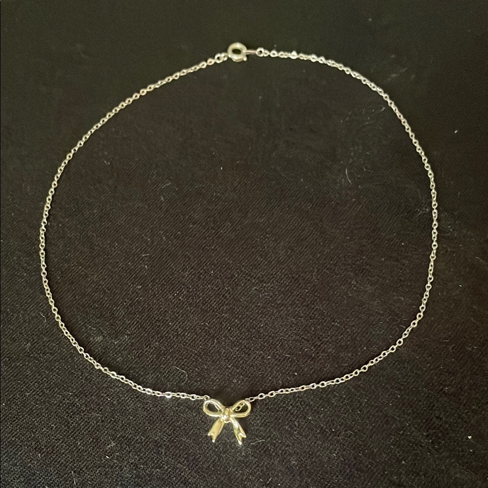 Dainty silver and gold bow necklace